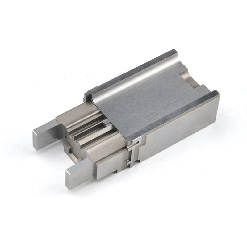 Precision machined metal part with parallel grooves, projecting ends and stepped structural features